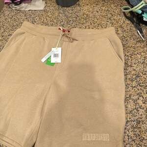GUESS Men's Fleece Shorts with Logo - Dulce Cream, Size Large